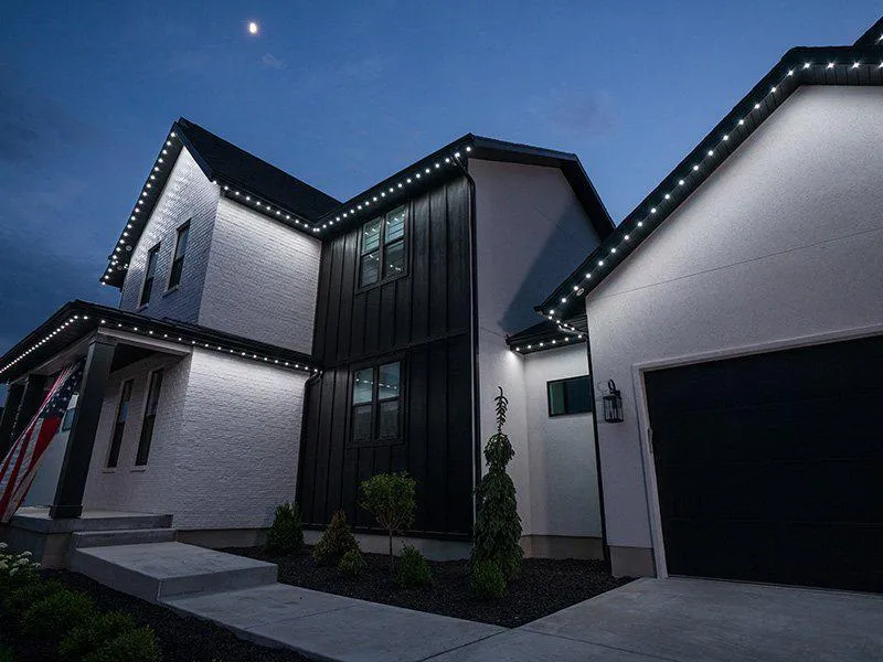 Permanent LED Holiday Lights installed on a modern two-story house in Rock Island, IL