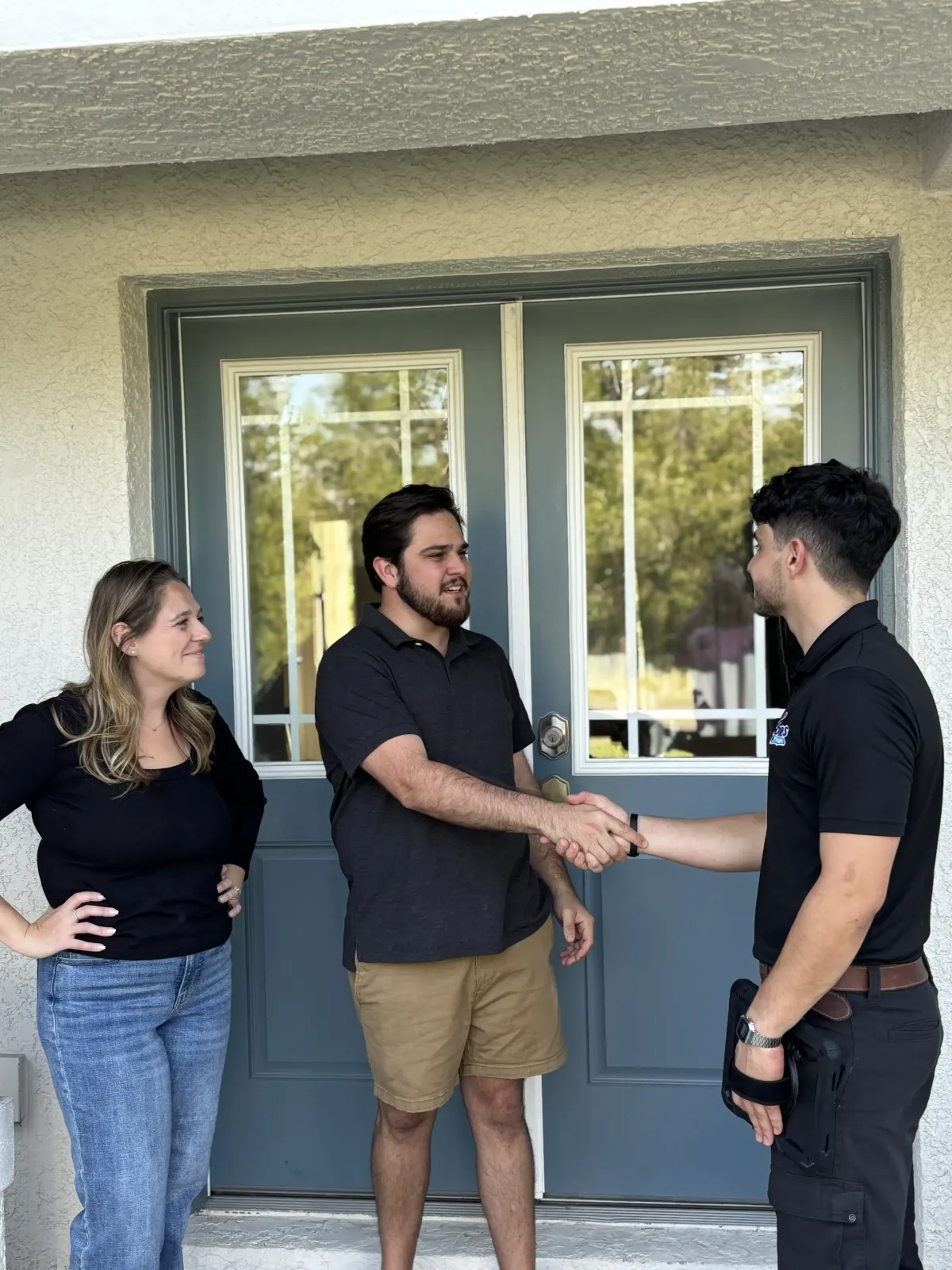 Plumbing talking to woman in kitchen. 