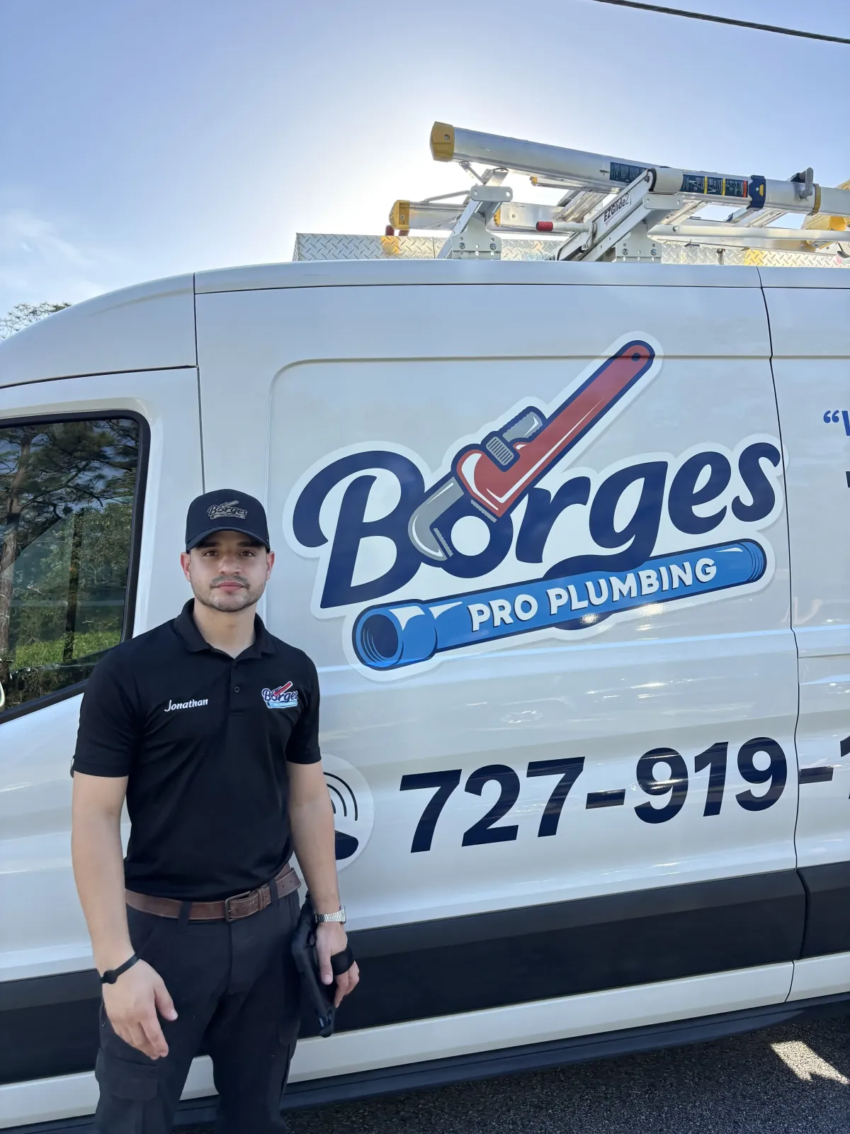 Crew in front of plumbing van