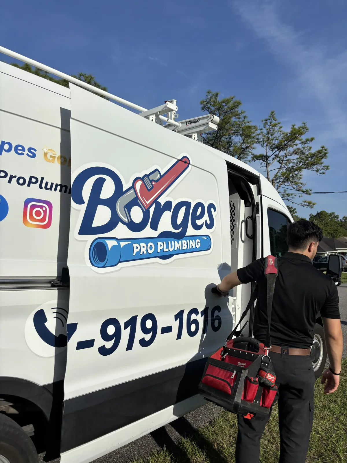 Crew in front of plumbing van