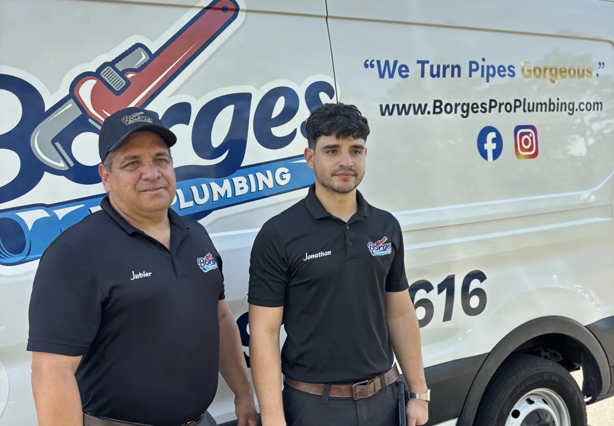 Crew in front of plumbing van