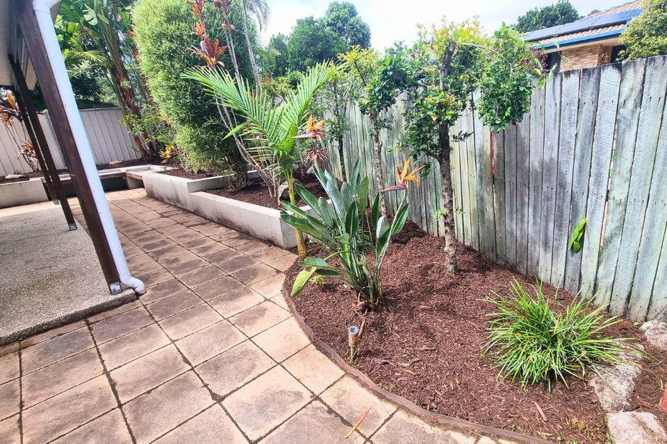 Fresh mulch finish after garden clean-up in Buderim