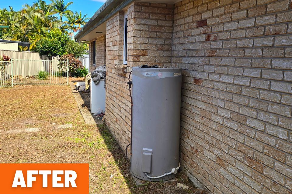 House wall cleared of weeds and vines after the Buderim backyard clean-up