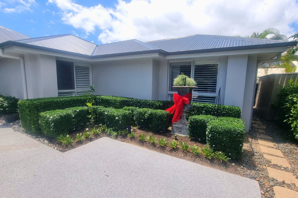 Freshly trimmed hedges and garden beds in Buderim