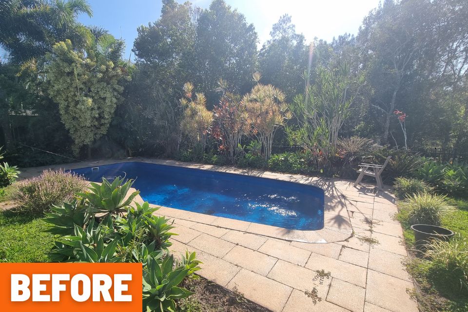 Backyard fence and ground shown after a major garden clean-up in Buderim.