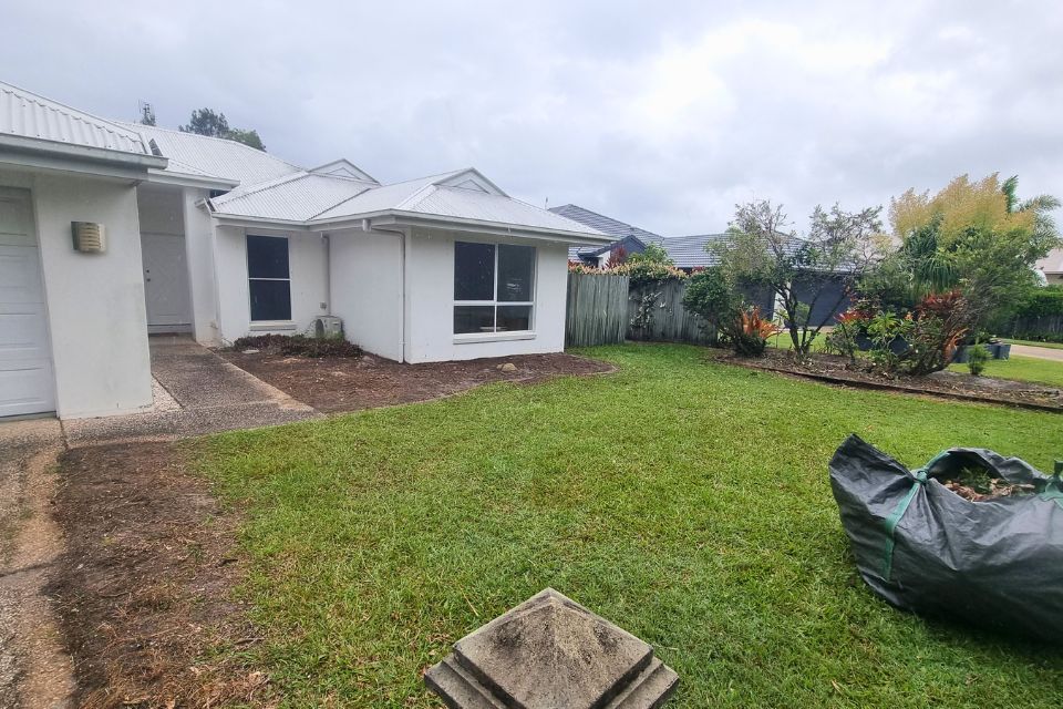 Overgrown backyard before a major garden clean-up in Buderim, with long grass, weeds and overgrown vegetation