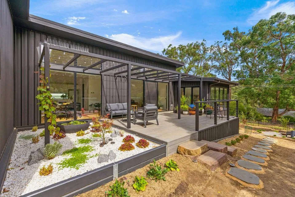 Landscaped outdoor entertainment deck and garden beds in Buderim