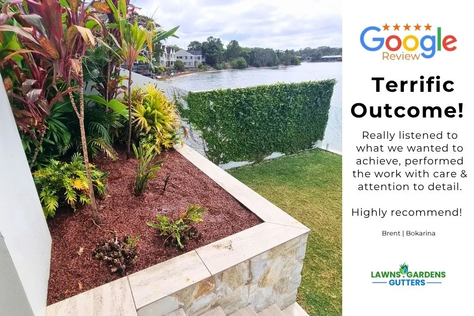 Lush tropical poolside garden makeover with fresh mulch and stone edging