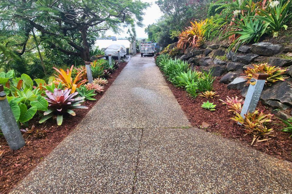 Buderim slopping block garden with tropical planting and mulched garden beds