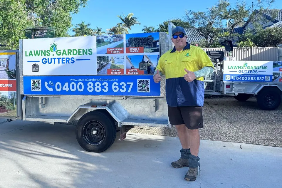 Gardener Neil standing with Lawns Gardens Gutters service ute and trailer in Buderim