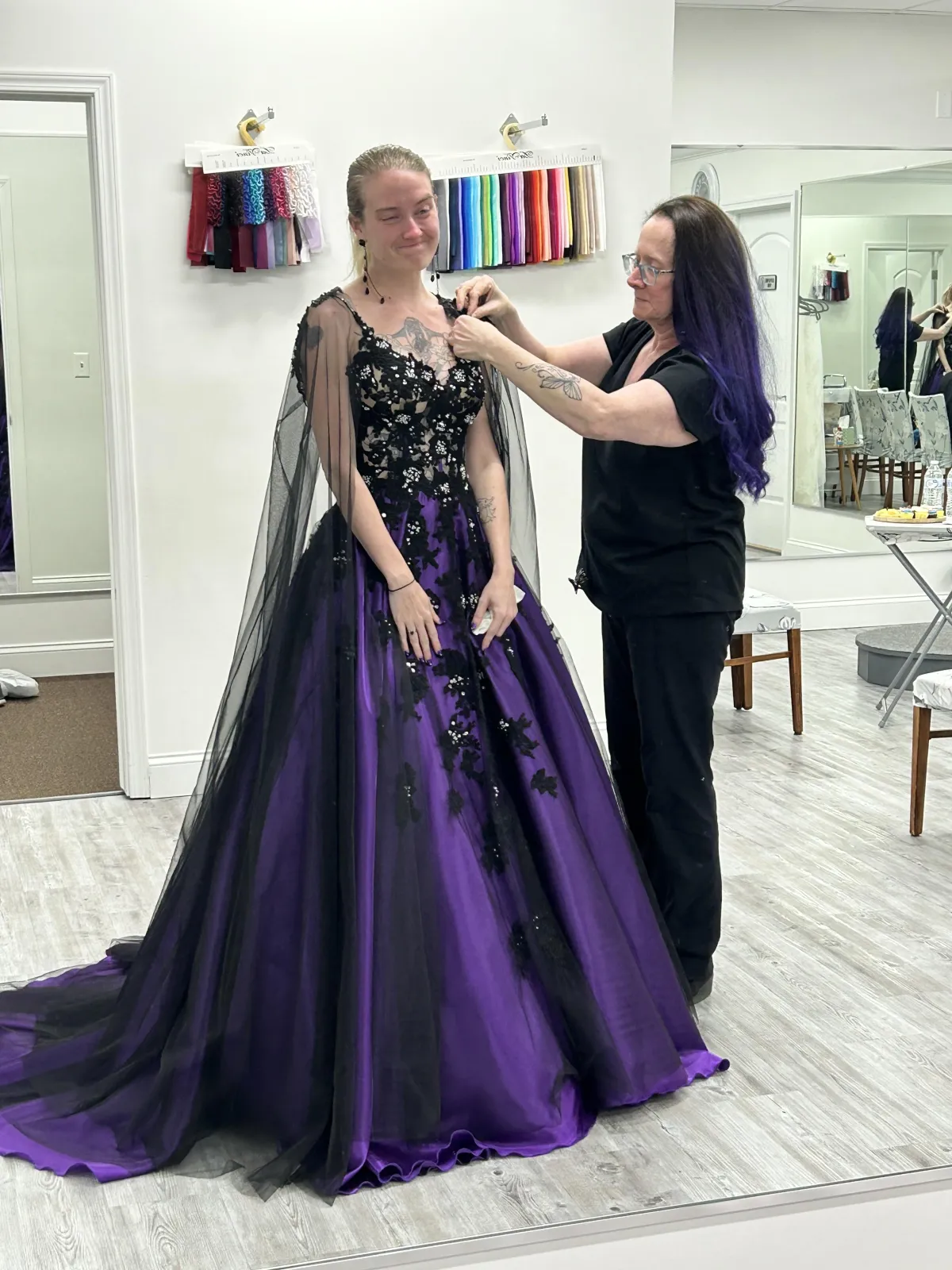 Bride holding a calla lily at an outdoor wedding.
