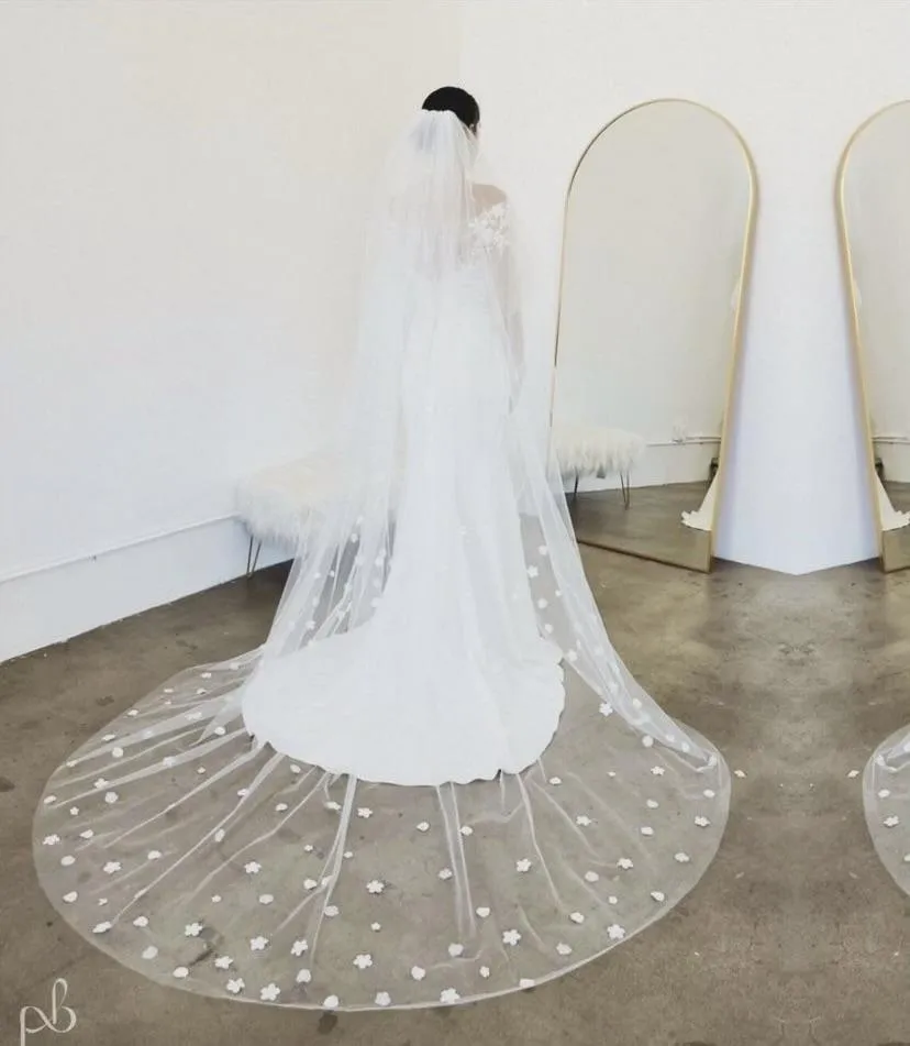 A wedding veil and dress await the bride.
