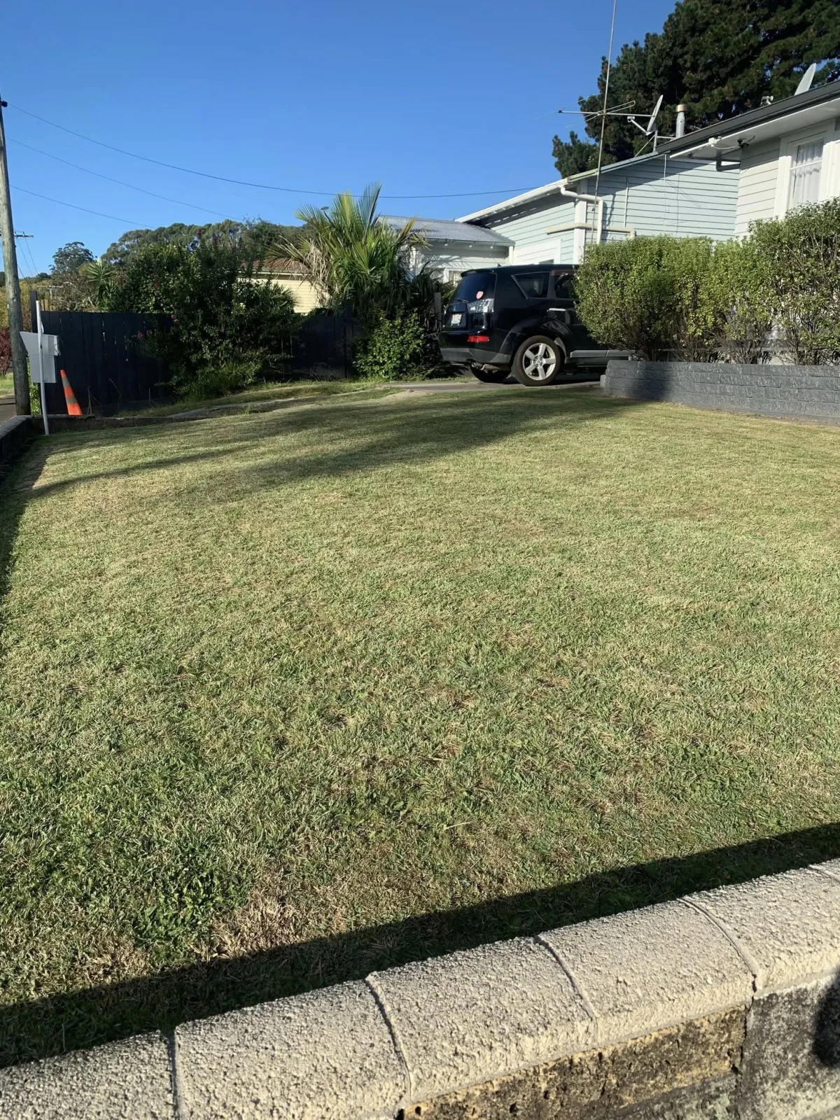 Freshly mown lawn outside a Gisborne home by Tiki Blasting exterior services