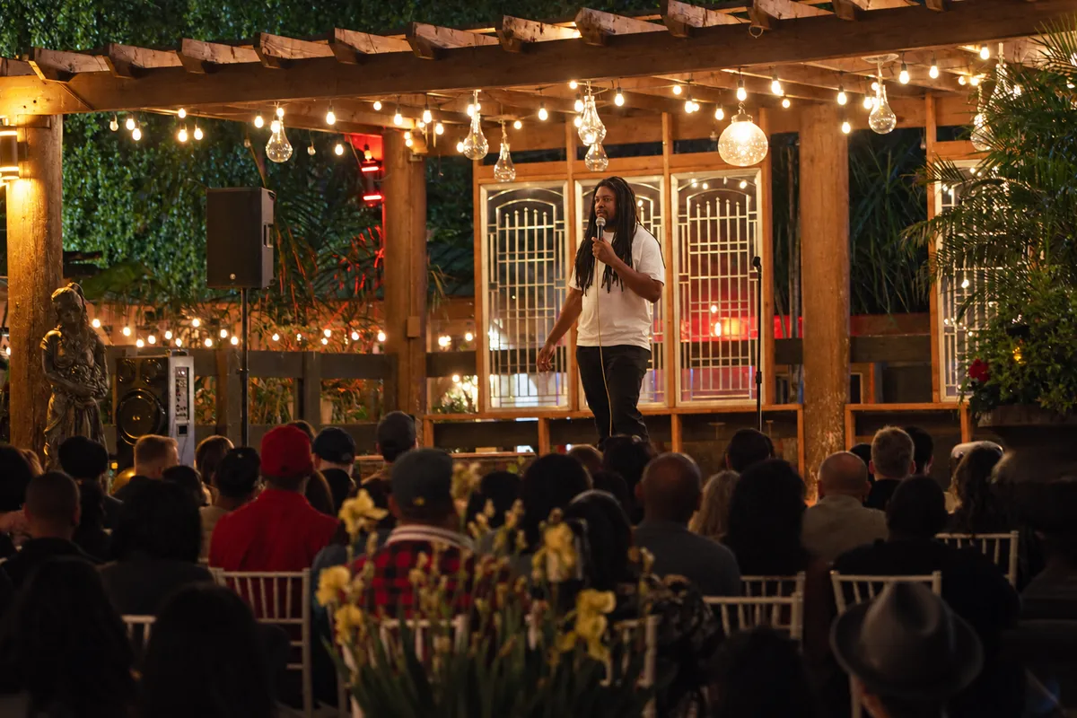 Bring people together: a blue-lit Los Angeles venue with a cream marquee