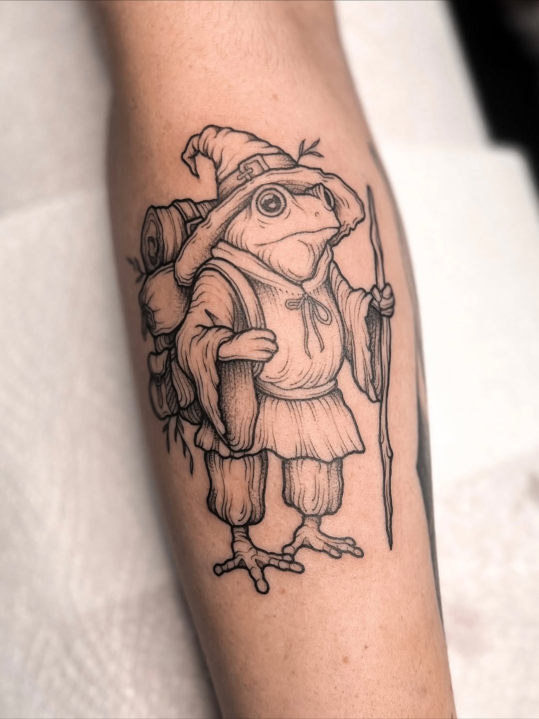 person in blue denim shorts and white nike sneakers standing on gray concrete floor