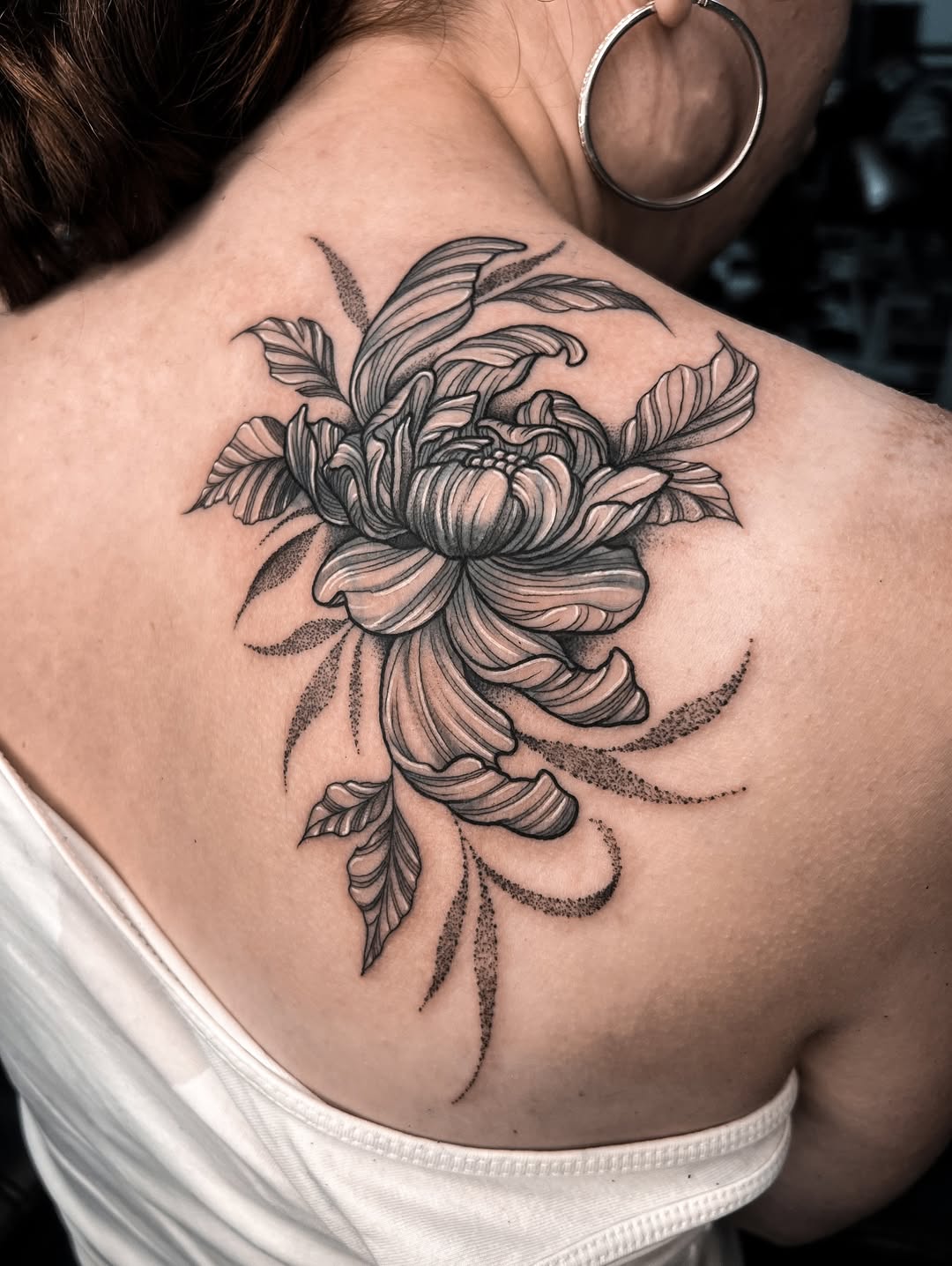 person with tattoo on right arm