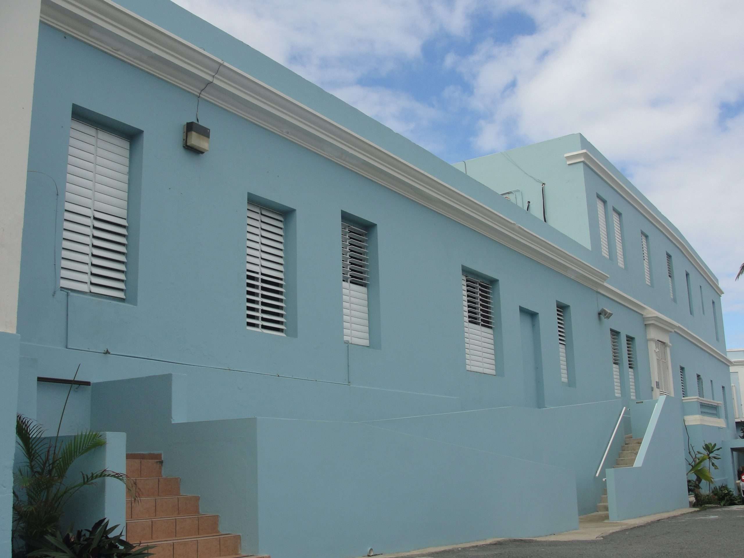 people sitting on brown wooden bench during daytime