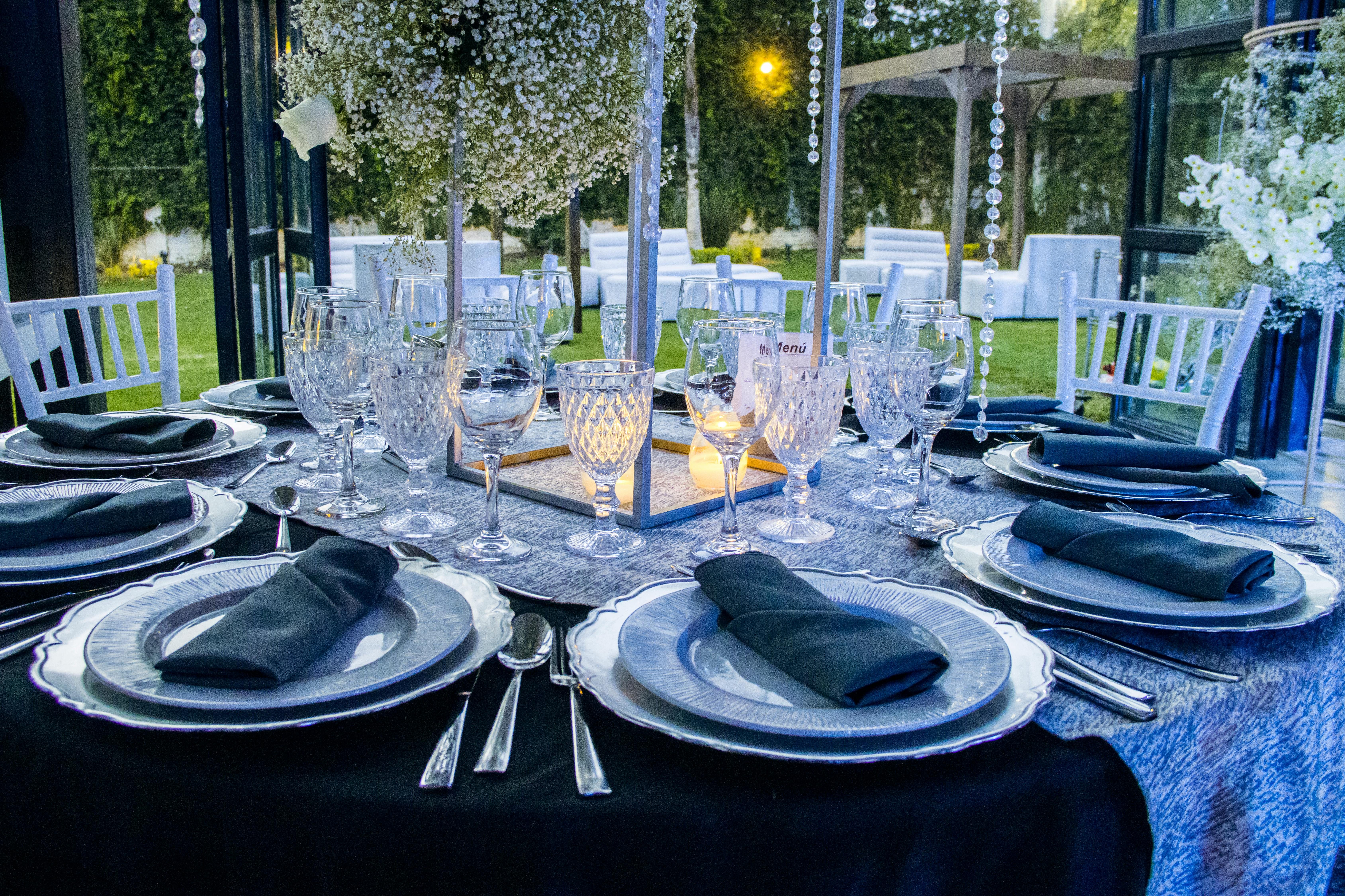 a long table with a bunch of glasses on it