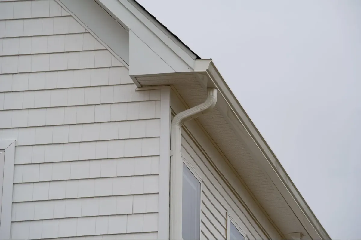 Seamless gutter installation on Missouri home exterior showing aluminum gutters and downspouts system