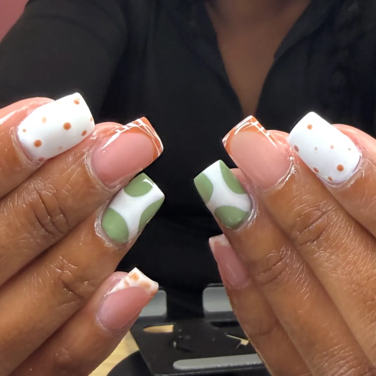 Feet submerged in a relaxing pedicure soak bowl.