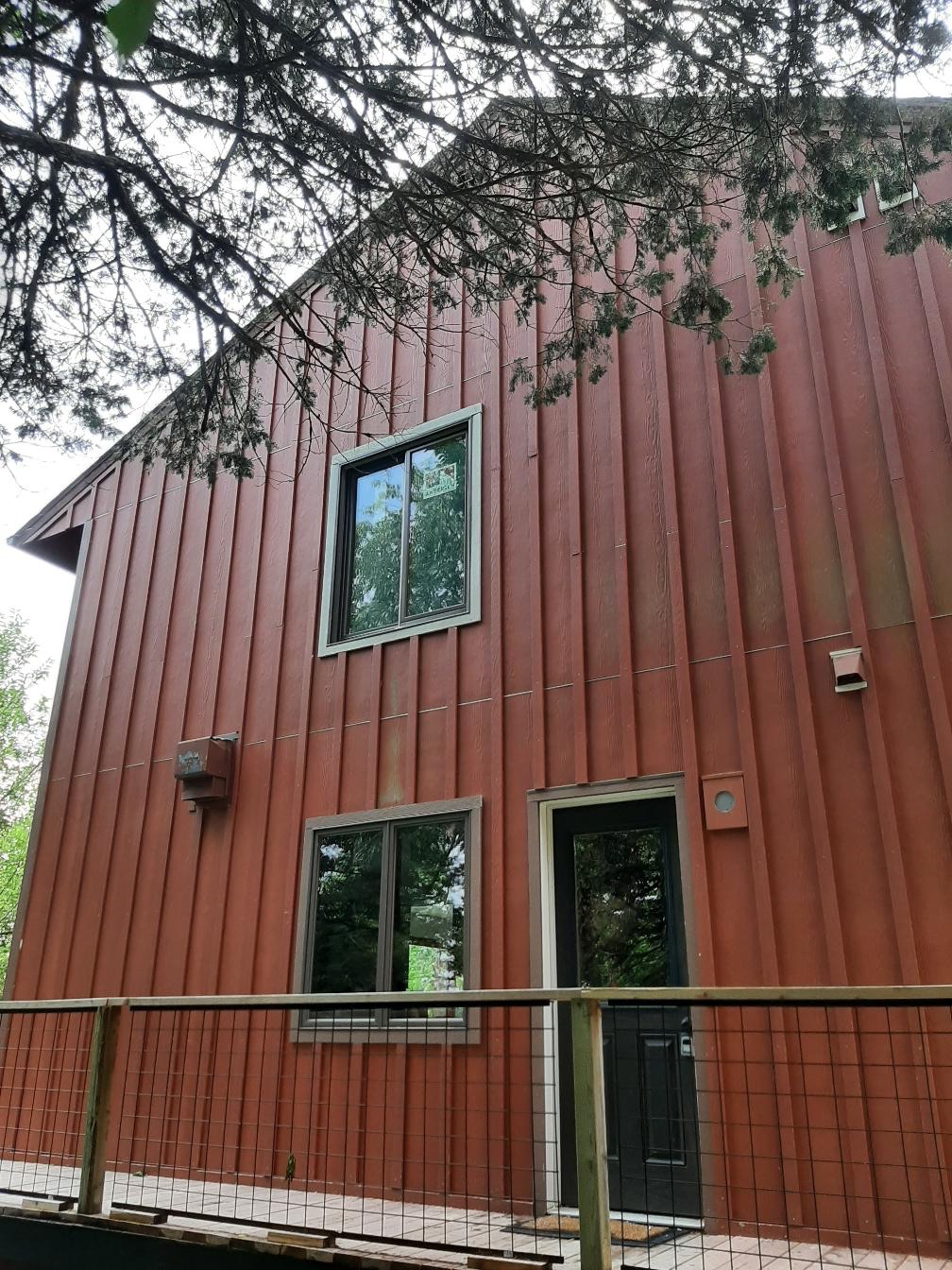 New vinyl window installation showing flawless trim work.