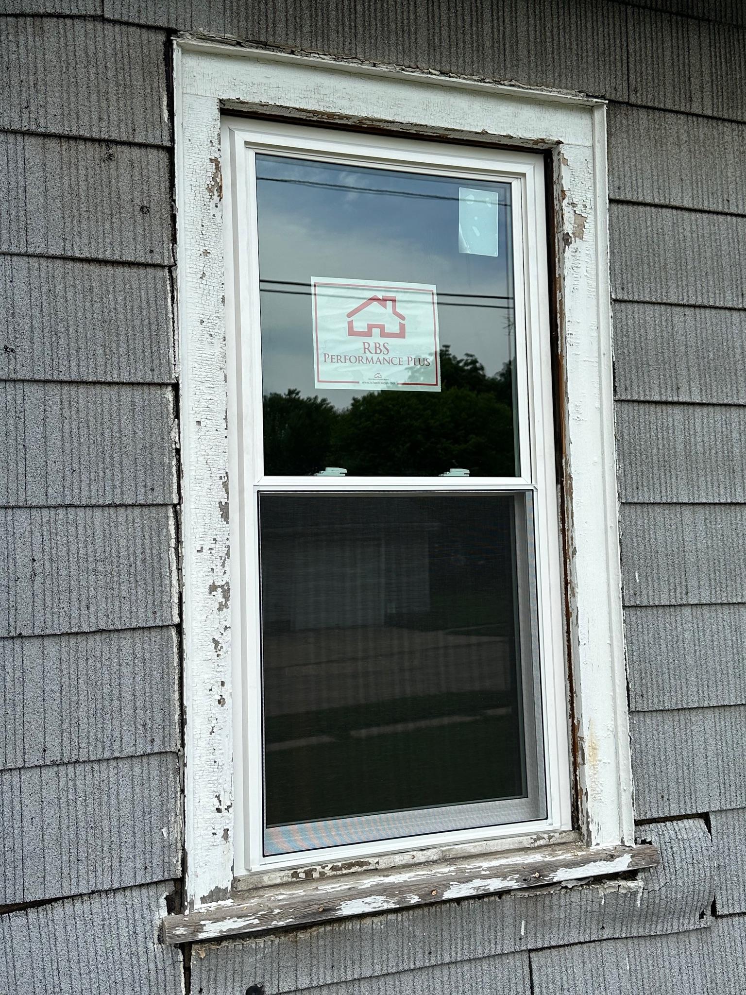 Large picture window installation looking out at the yard.
