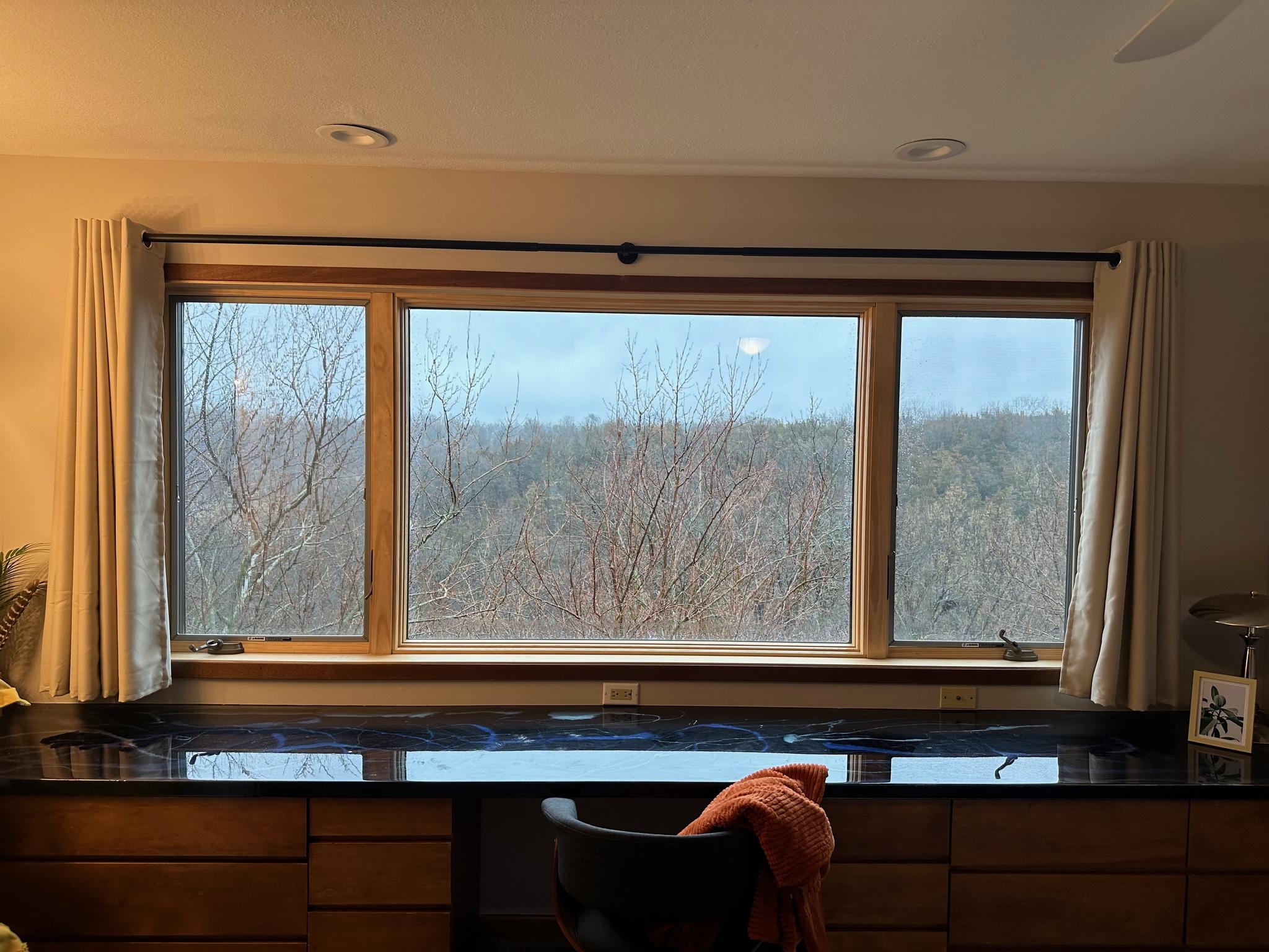 New double-hung windows showing secure locking mechanisms.