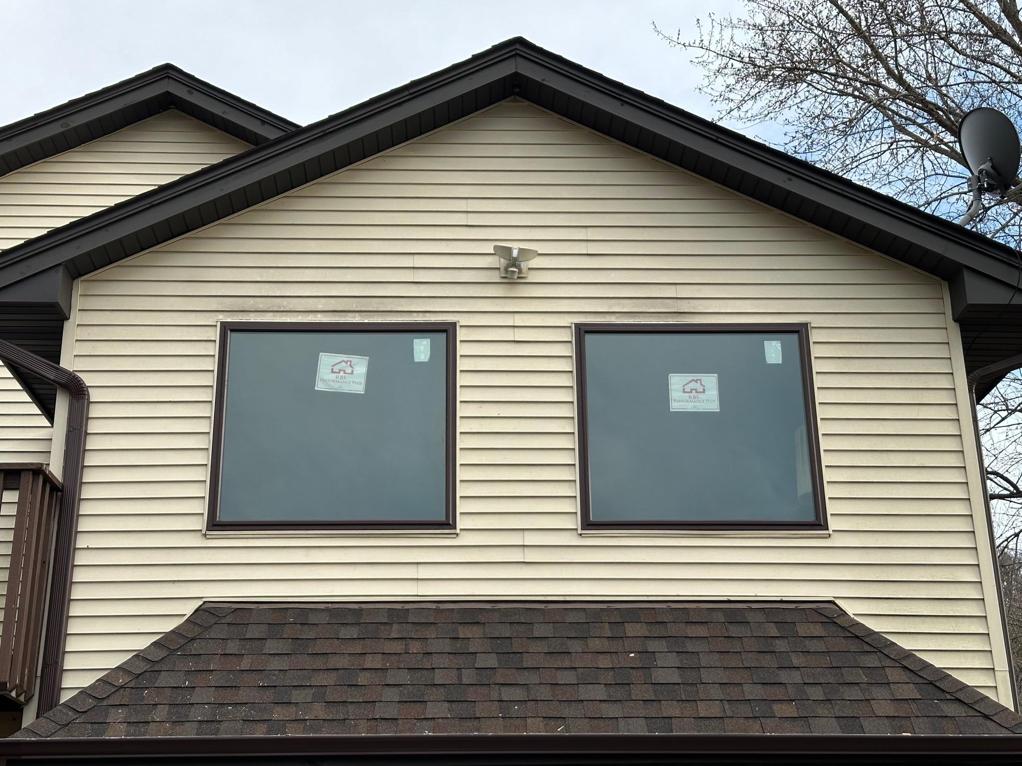 New double-hung window installation by professional contractors in Lena, IL.