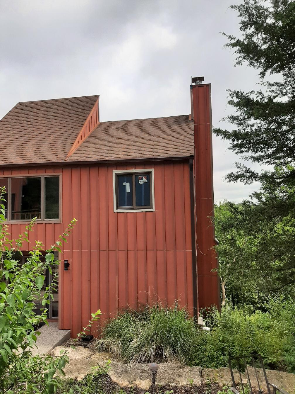 New double-hung vinyl window seamlessly integrated into residential siding.