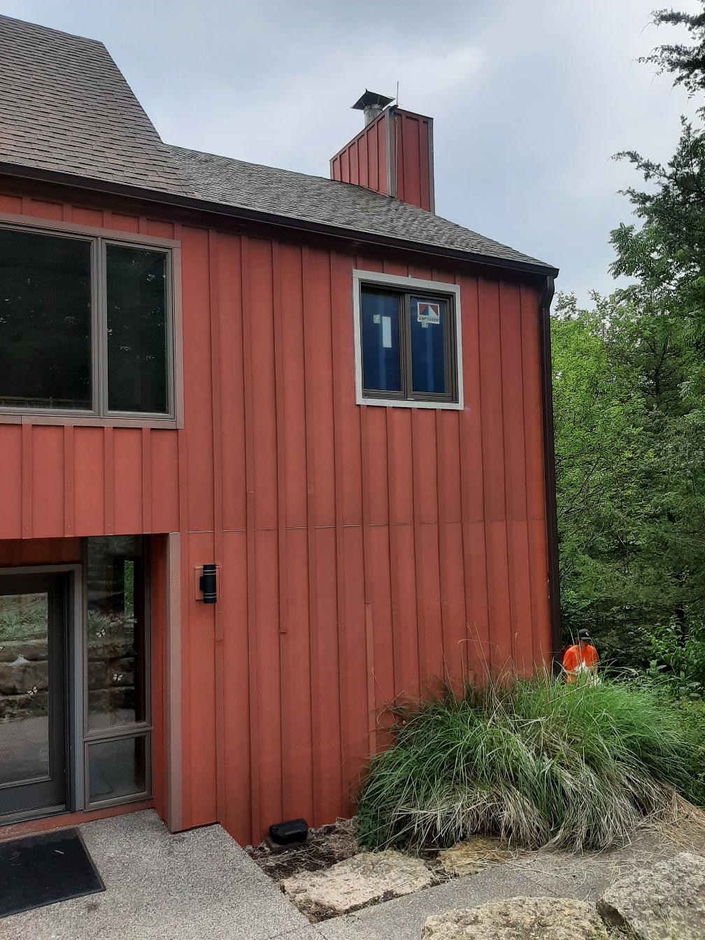 Two-story home with newly replaced vinyl windows.