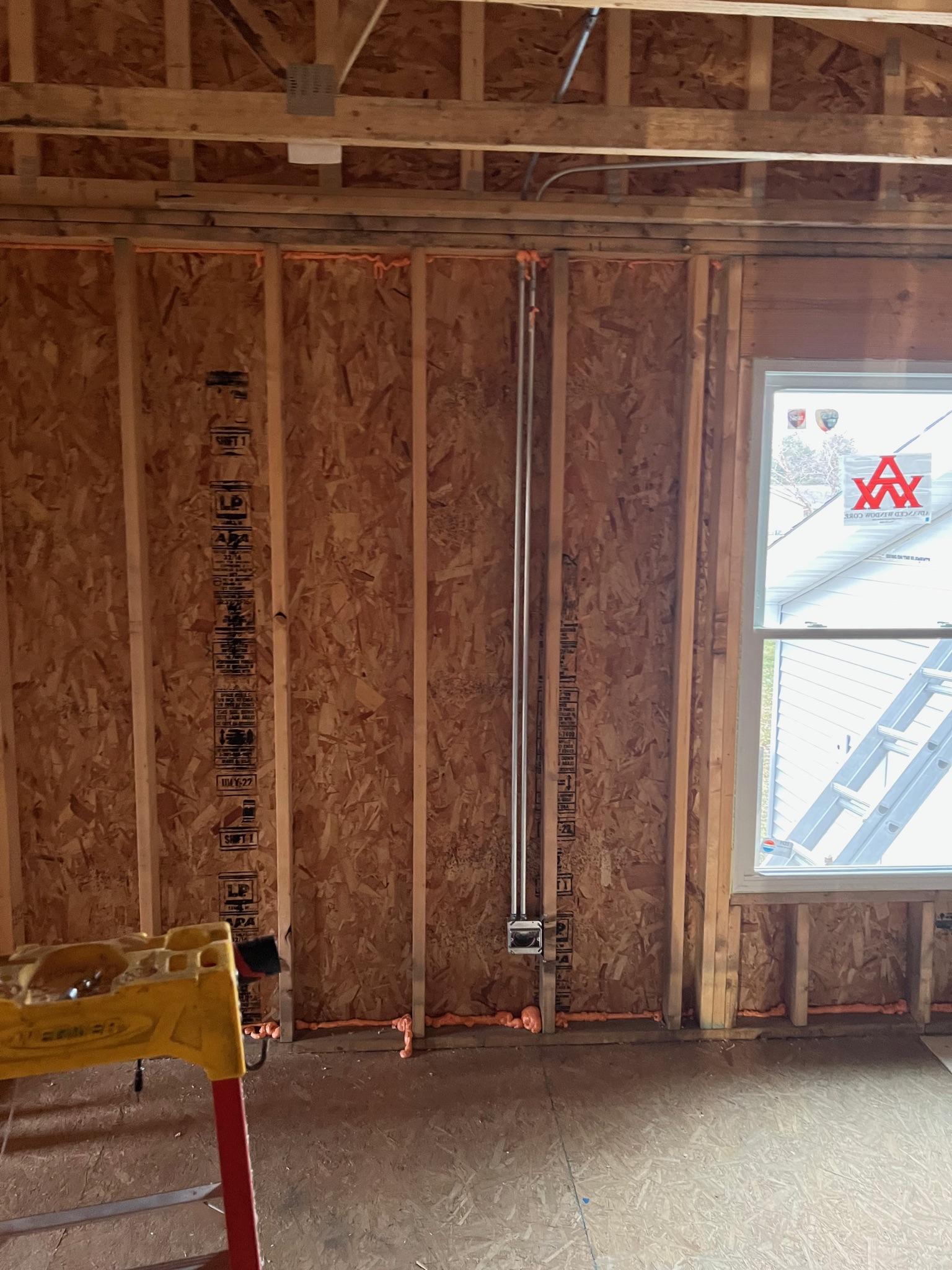 Finished window casings and trim molding on a new window installation.