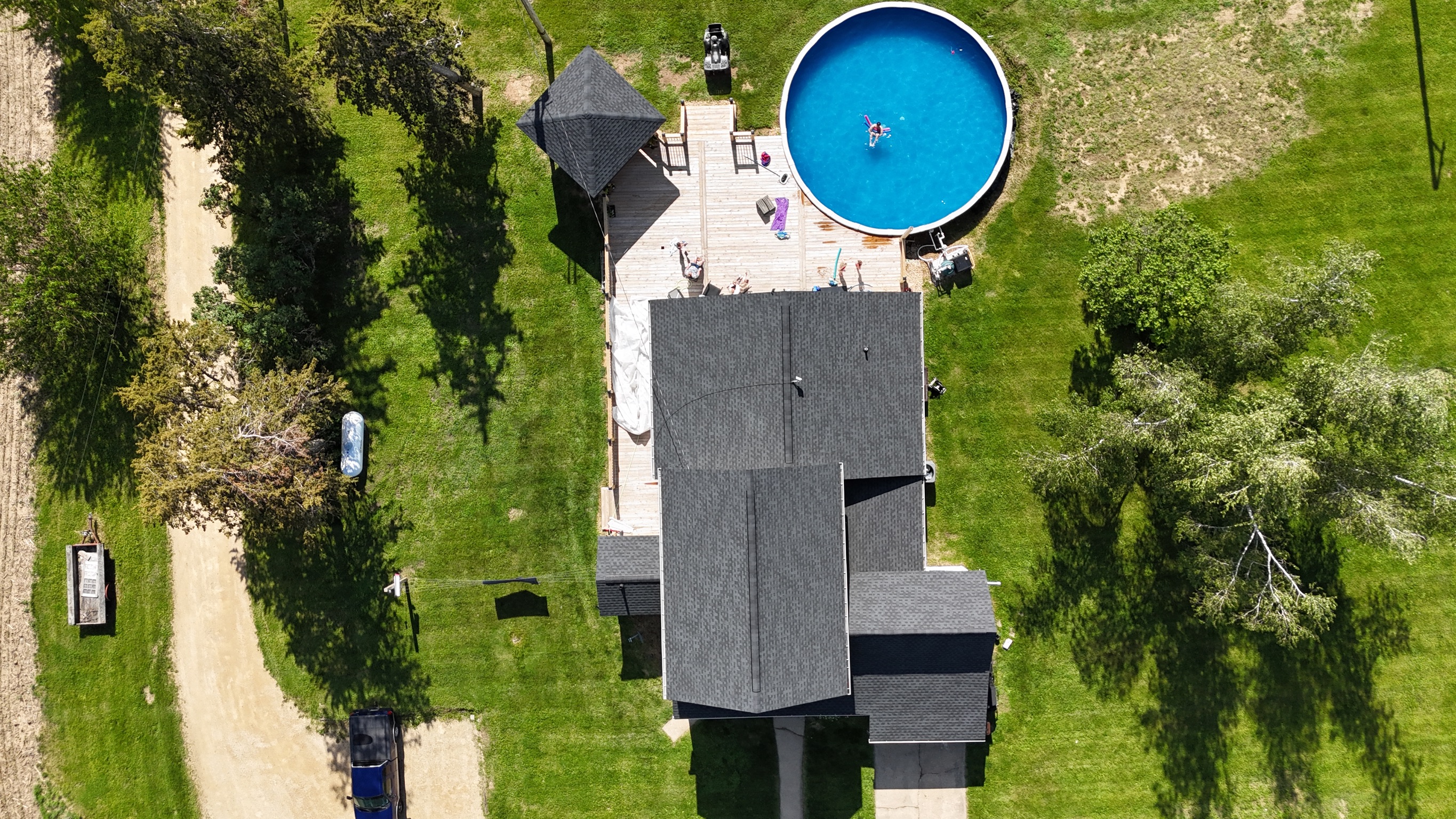 Aerial view of a gray architectural shingle roof installation by Precision Exteriors Inc.