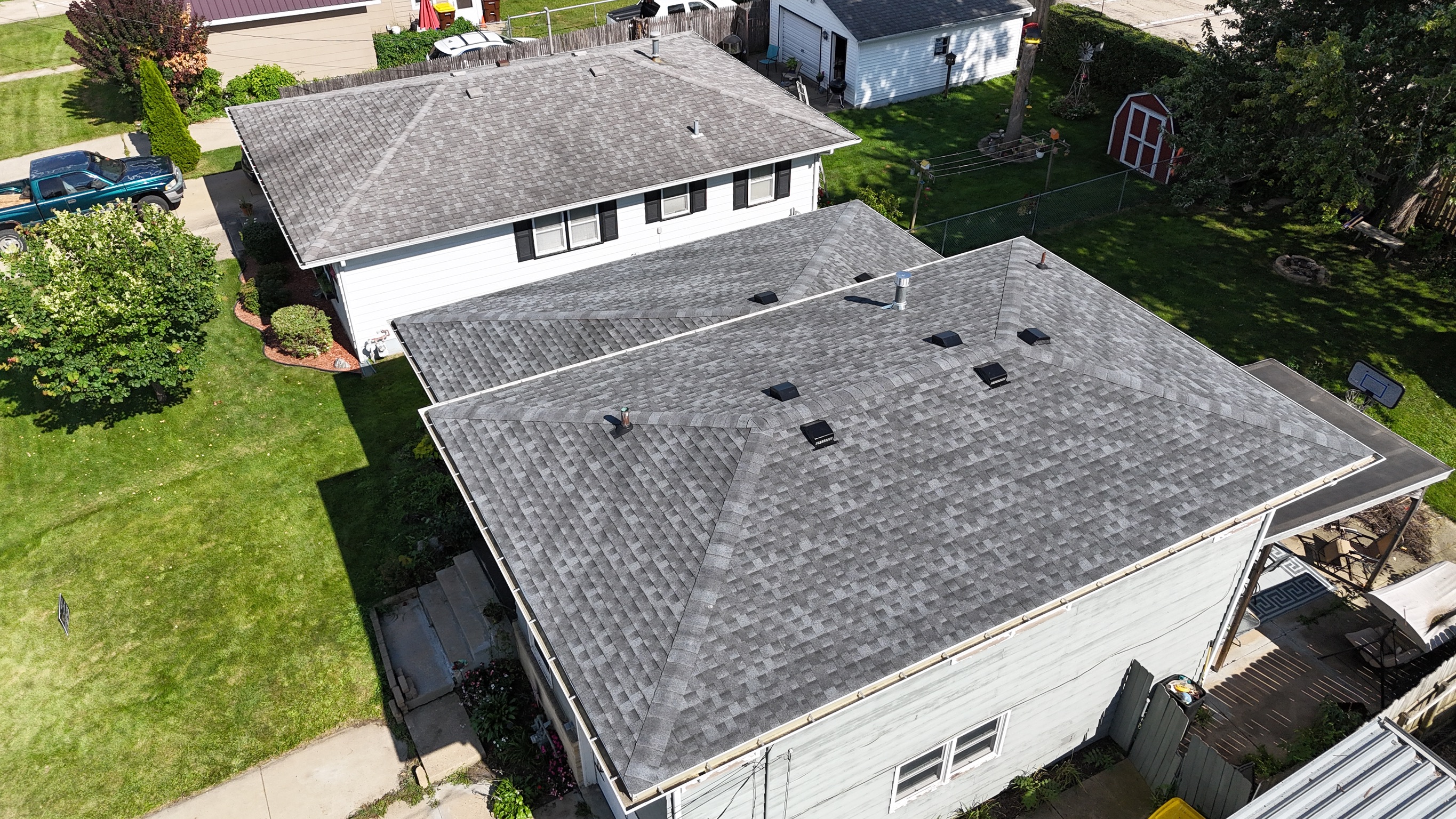Top-down view of a flawless new shingle roof installation.