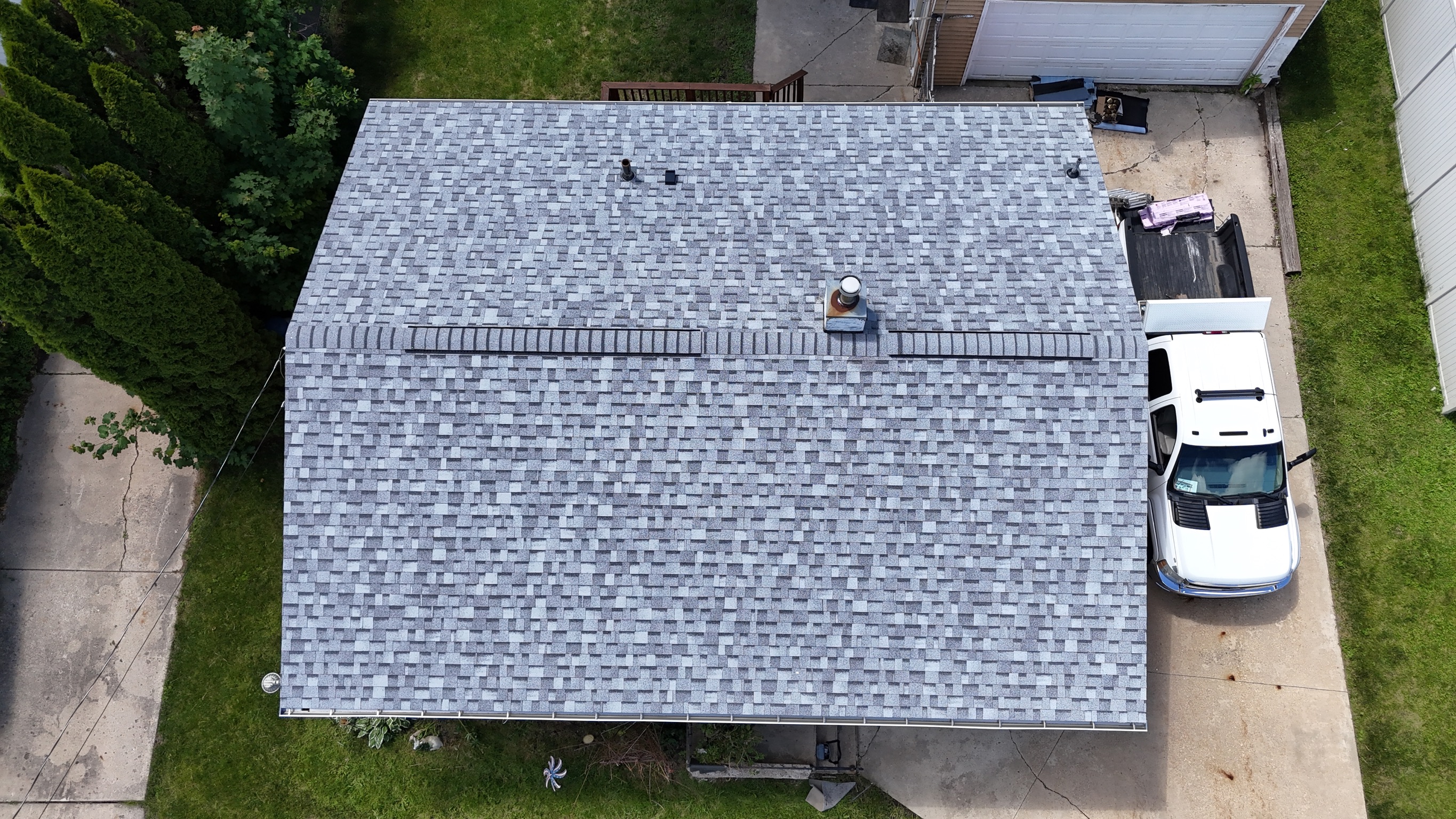 Drone shot of a completed roof replacement on a ranch-style home.