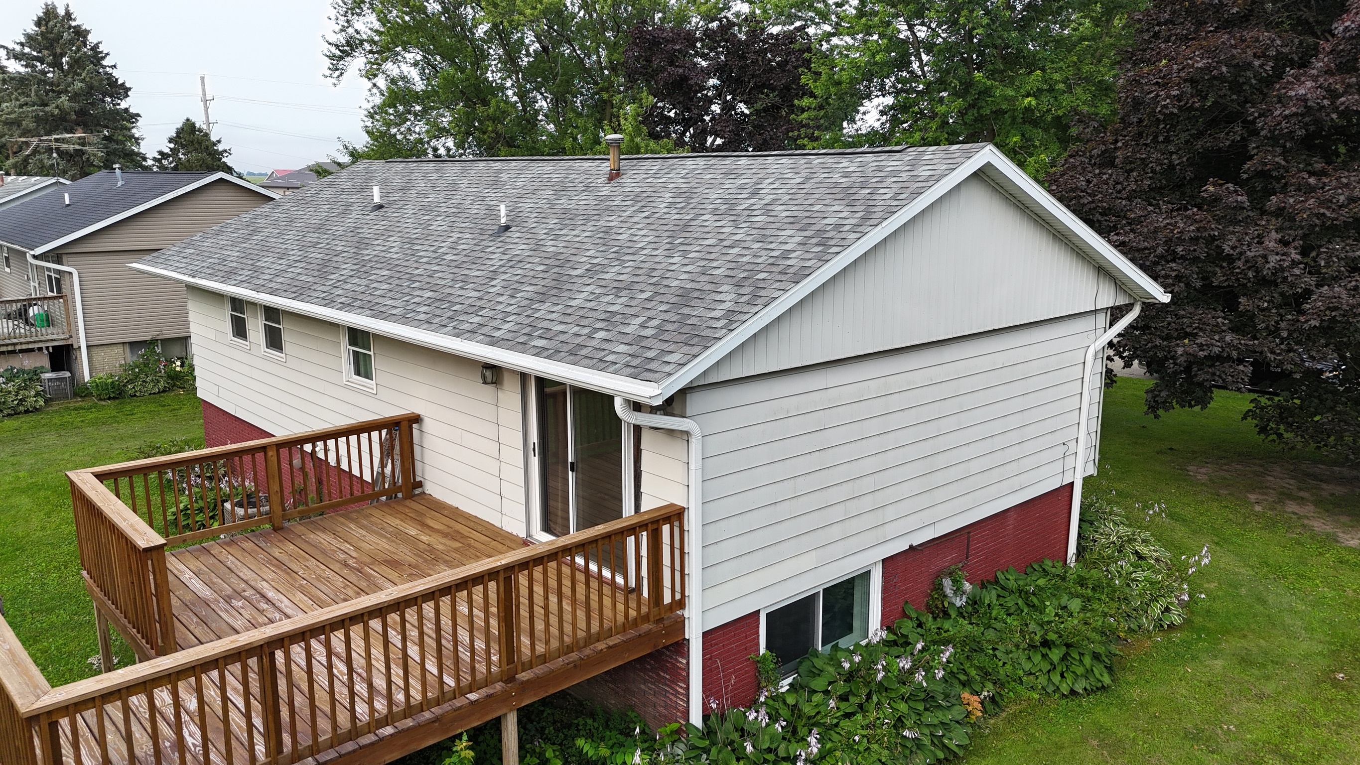 New asphalt shingle roof installation completed by Precision Exteriors Inc.