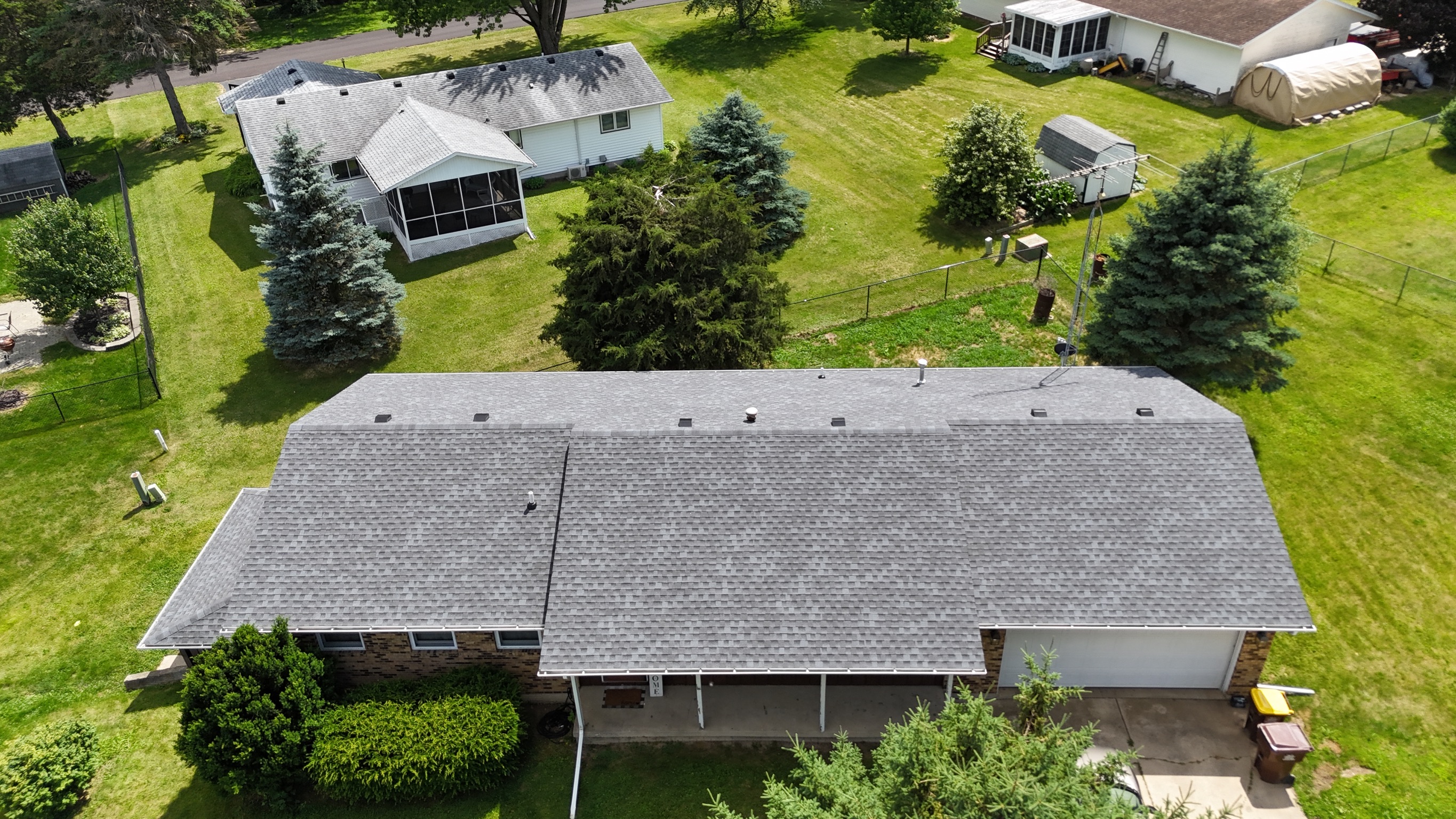 Completed gray architectural shingle roof installation.