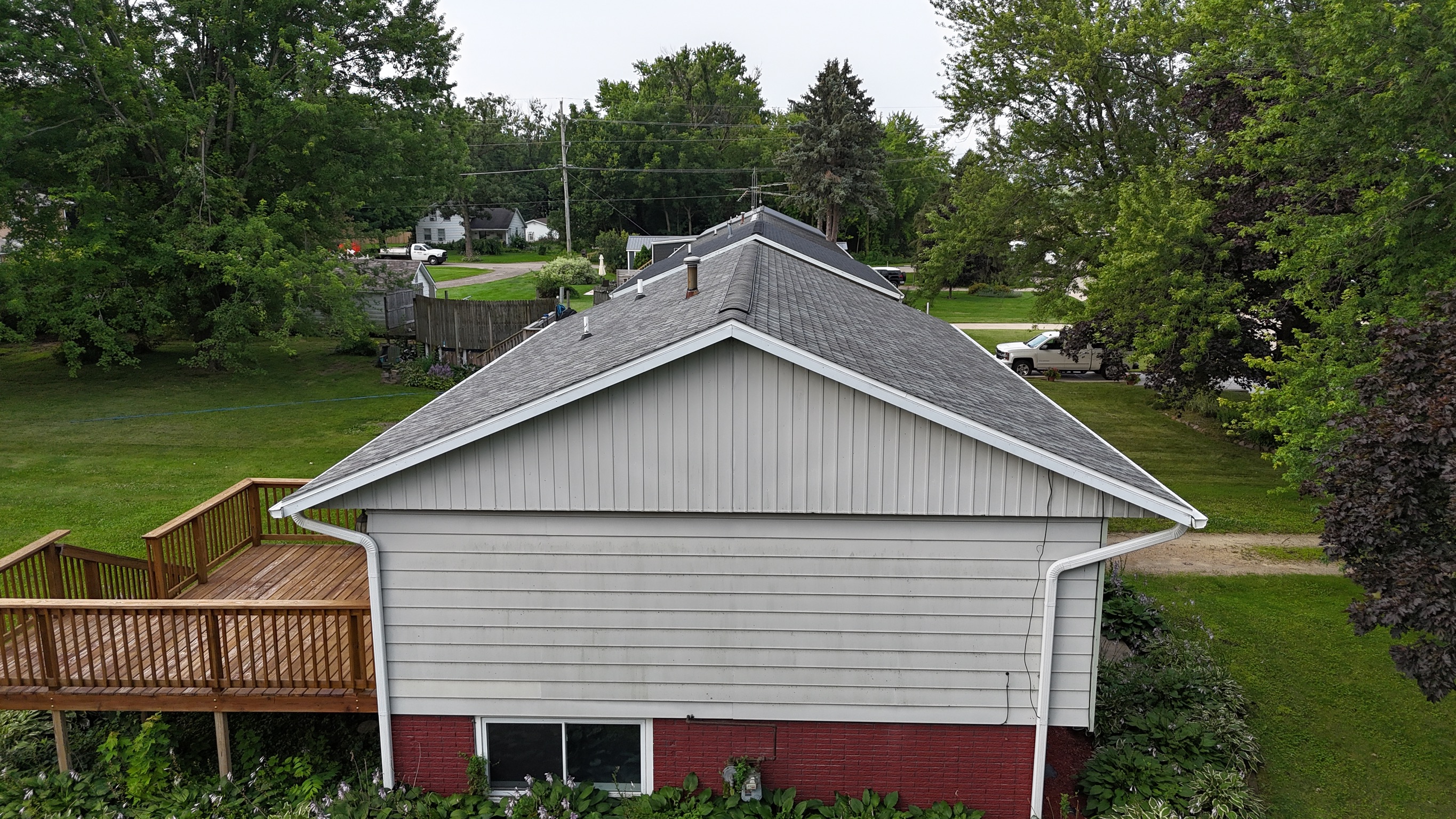 Completed residential roofing project showing clean lines and new shingles.