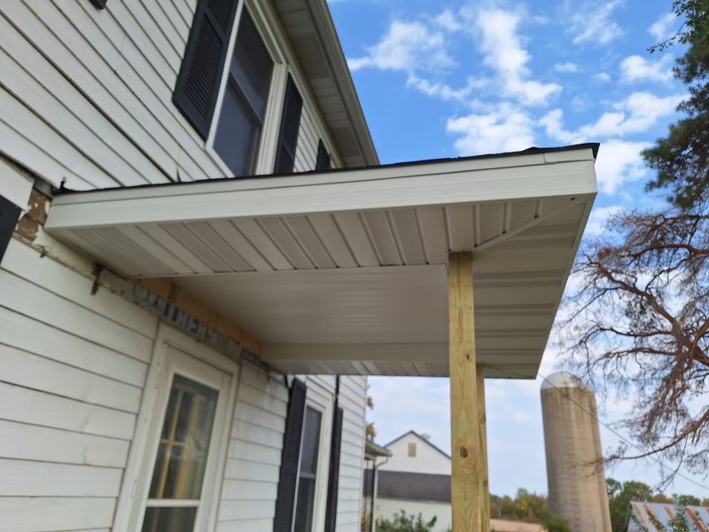 Siding and porch trim work completed by Precision Exteriors Inc. in Lena, IL.