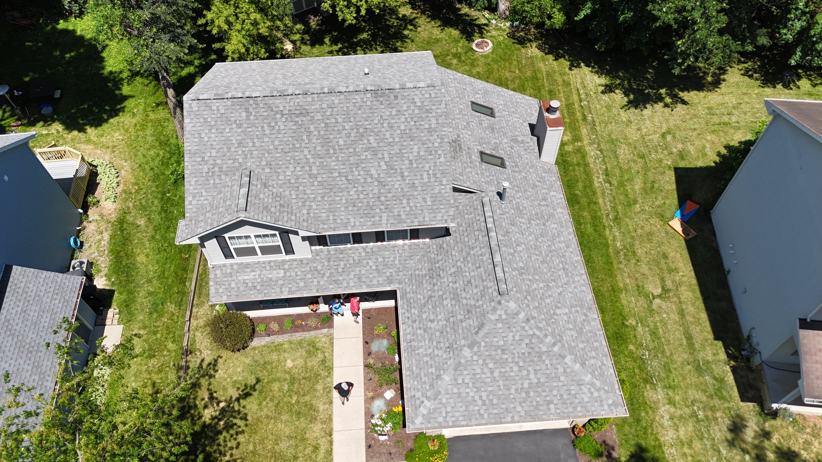 Finished residential roof with premium architectural shingles.