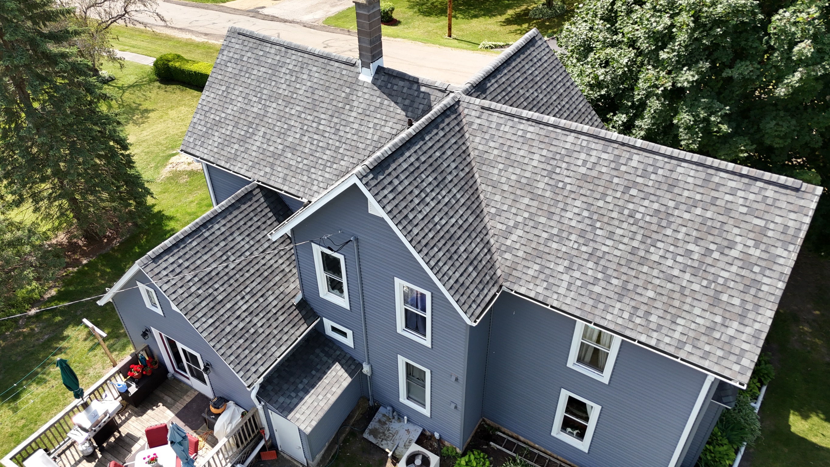 New gray shingle roof installation on a residential home by Precision Exteriors Inc.