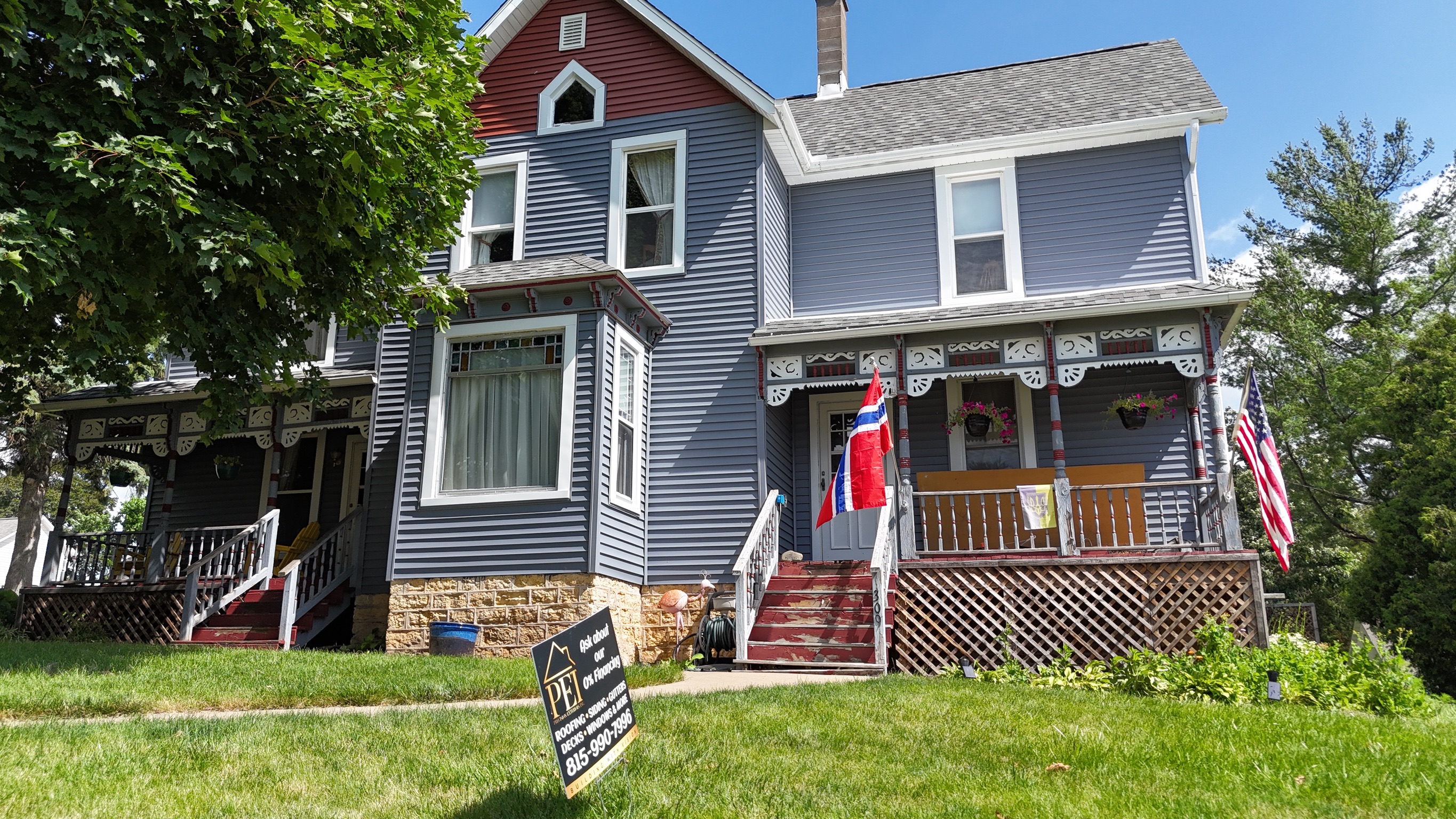 Street-level view of a house with a newly installed shingle roof.