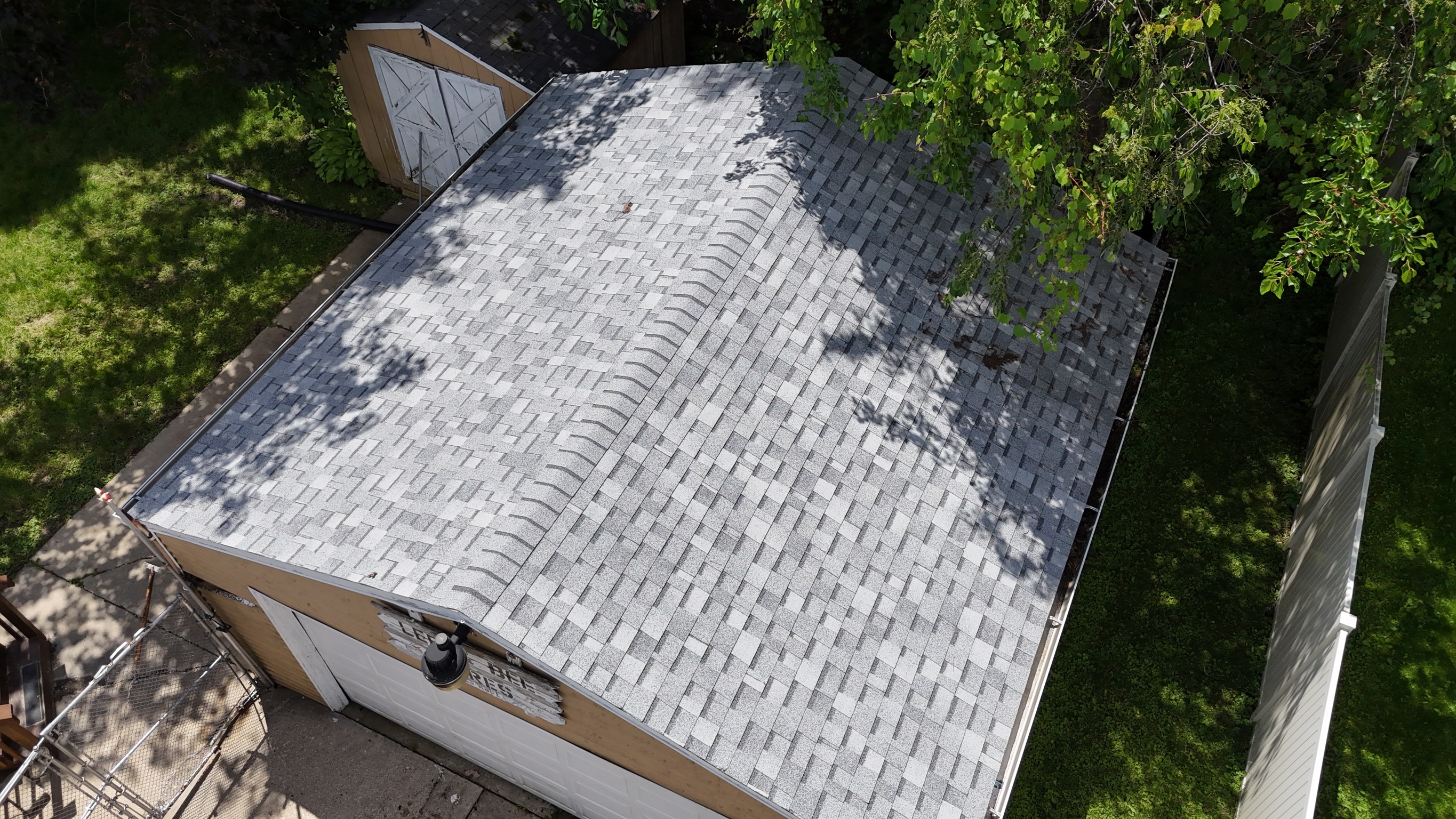 Completed roof installation on a two-story home in Lena, IL by Precision Exteriors Inc.