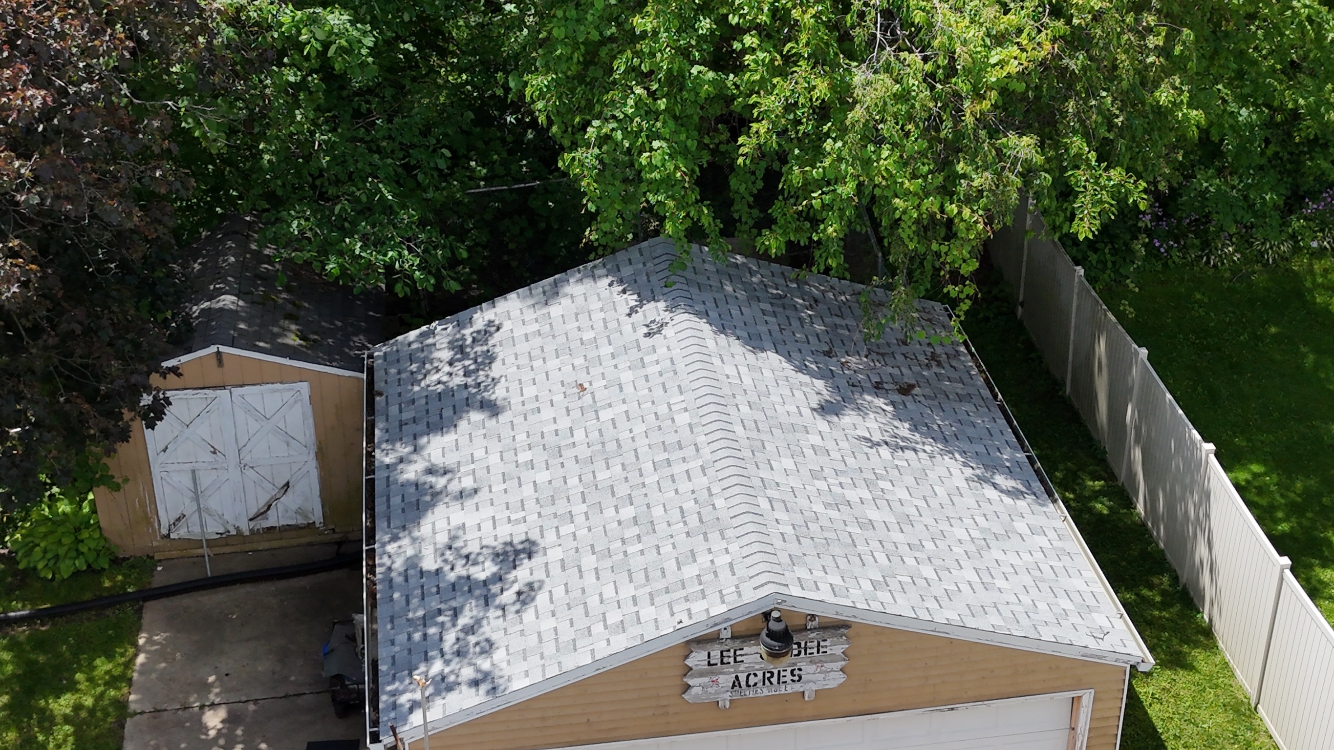 Finished architectural shingle roof on a two-story house in Lena, IL.