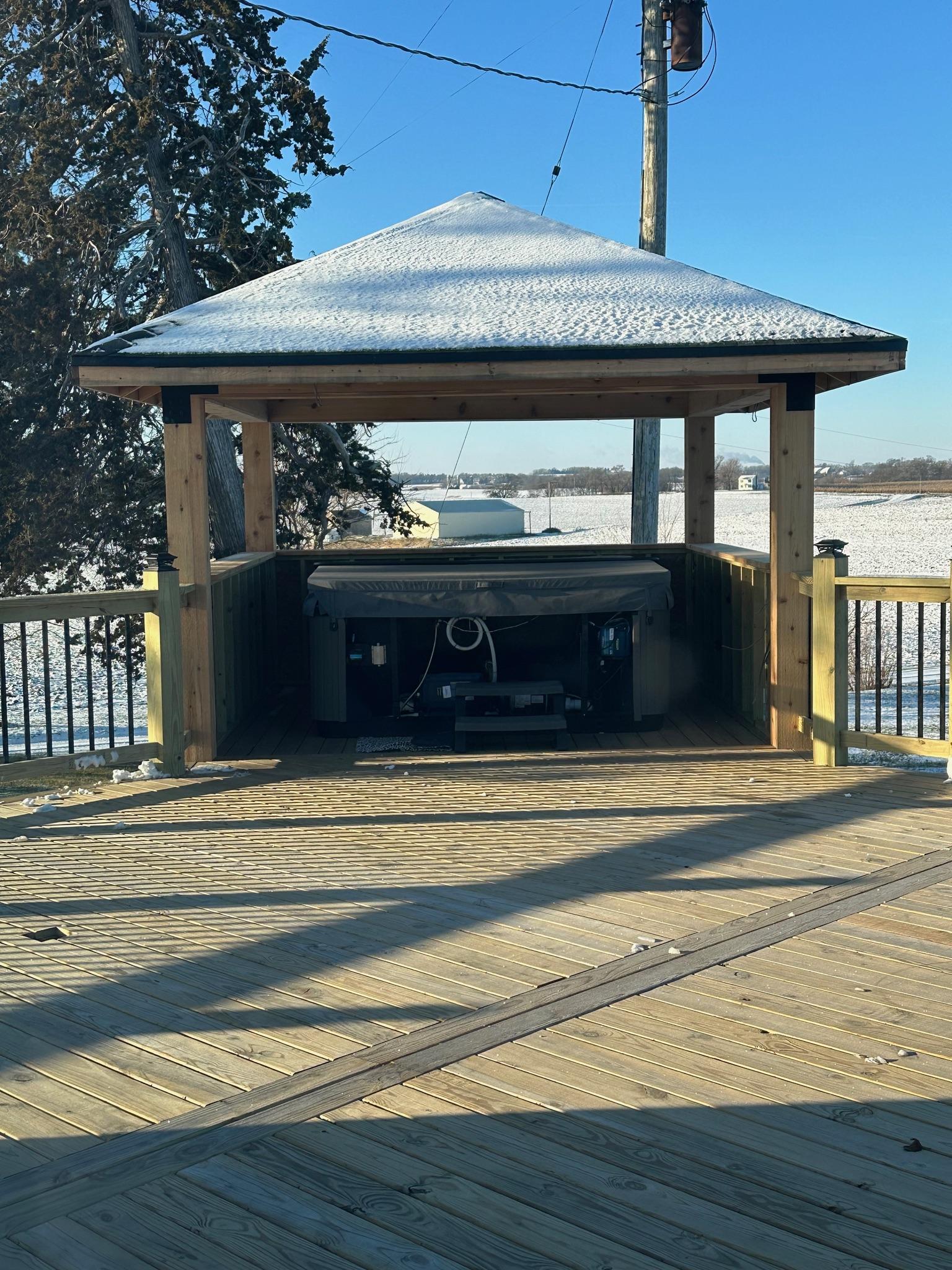 Custom outdoor wood deck and hot tub gazebo pavilion built by Precision Exterior Inc.