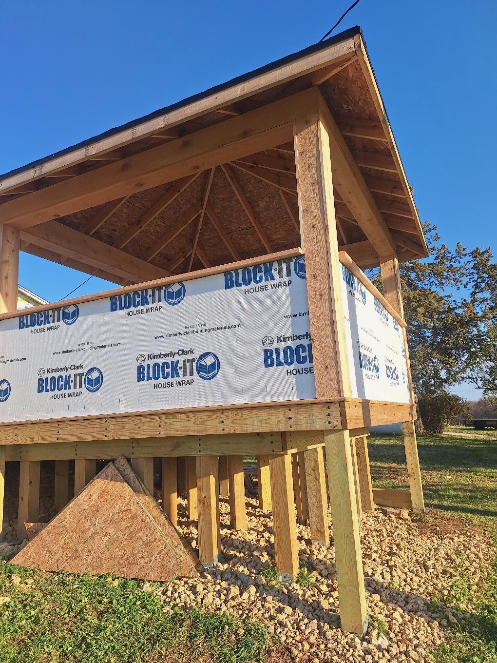 Custom residential wood gazebo framing and covered deck pavilion under construction by Precision Exterior Inc.