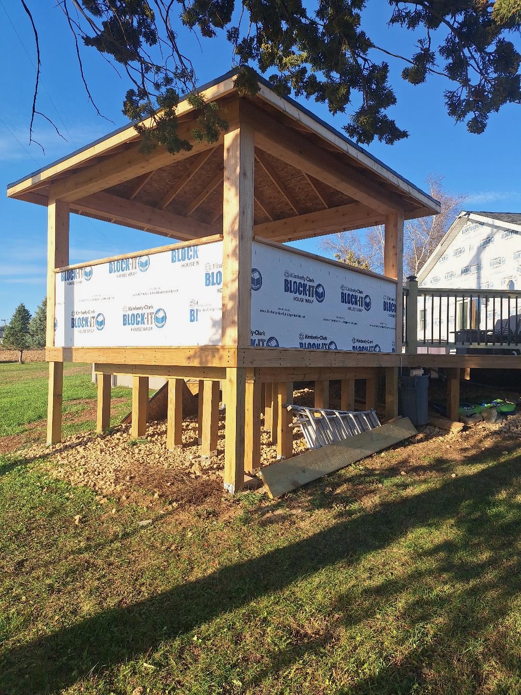 Custom residential wood gazebo and covered deck pavilion framing project under construction by Precision Exterior Inc.