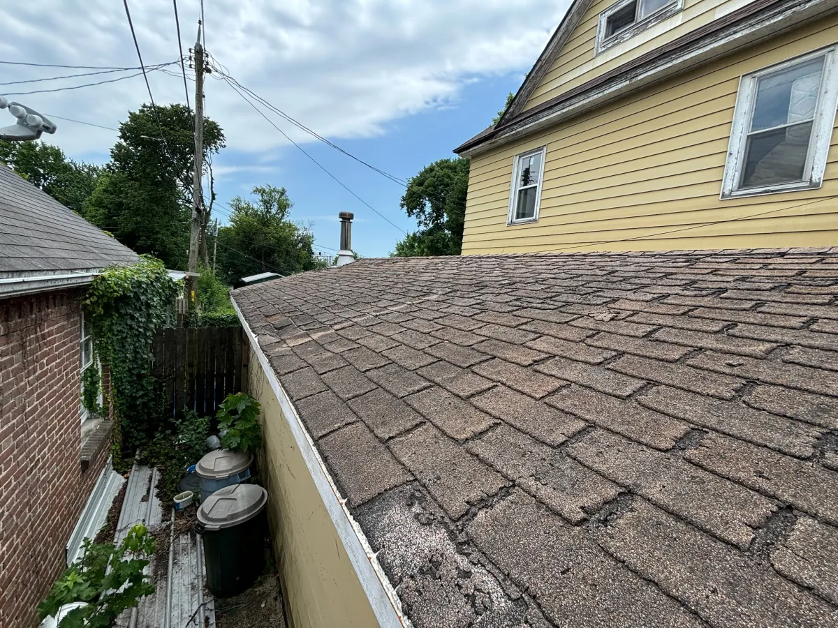 Close-up of roofing shingles and siding materials used in exterior remodeling projects