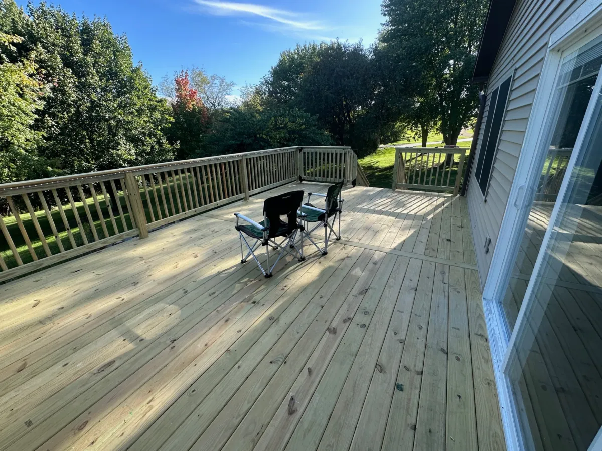 Custom built wooden backyard deck construction by Precision Exteriors Inc