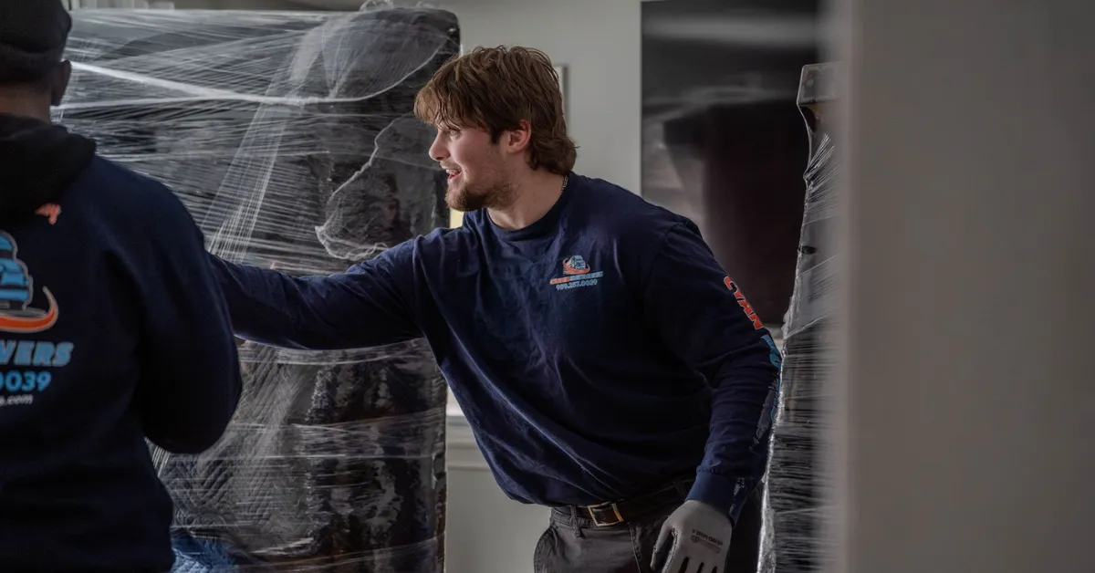 Professional movers wrapping furniture for local and long distance moving in Los Angeles CA