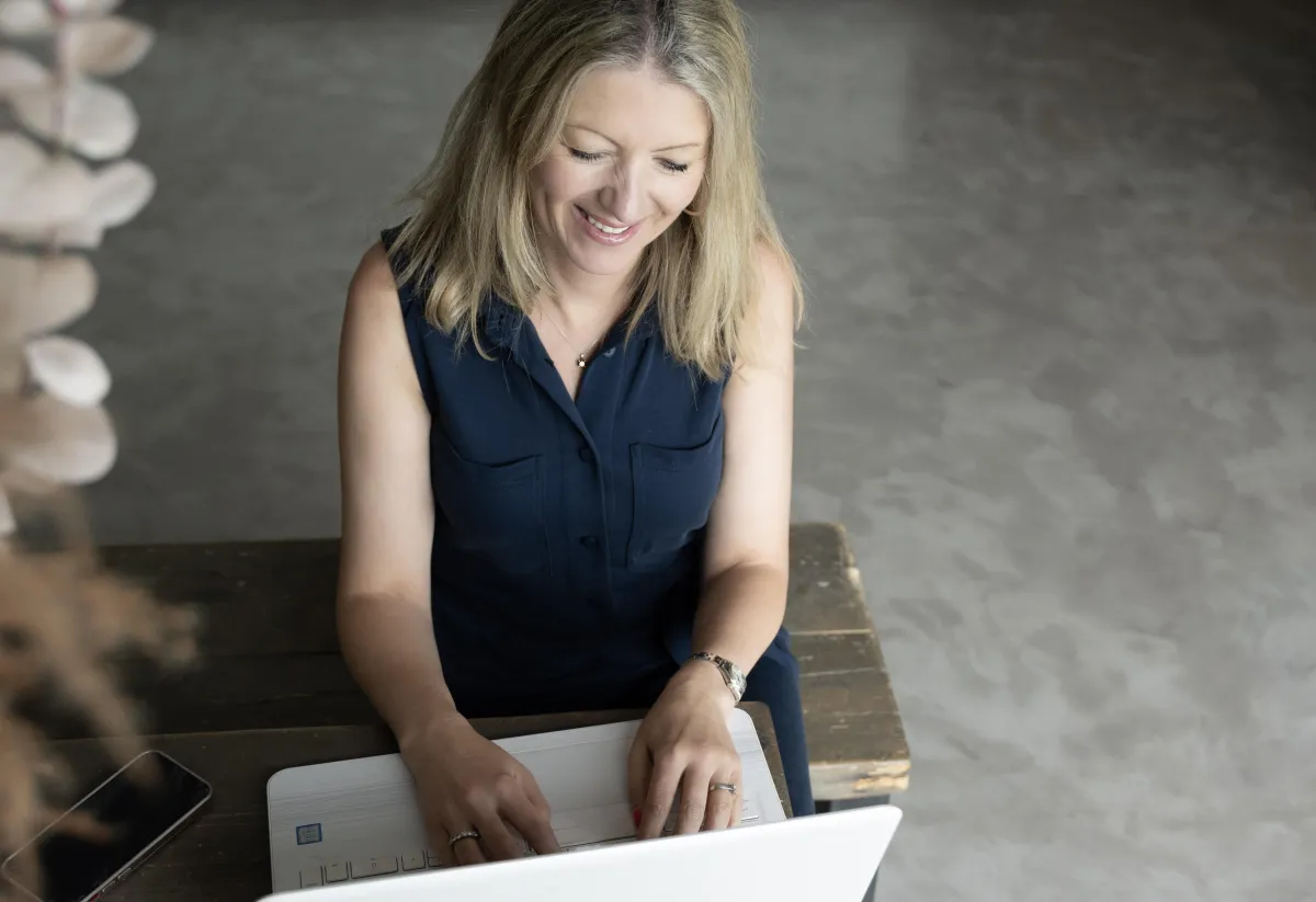 person working on their financial information on laptop